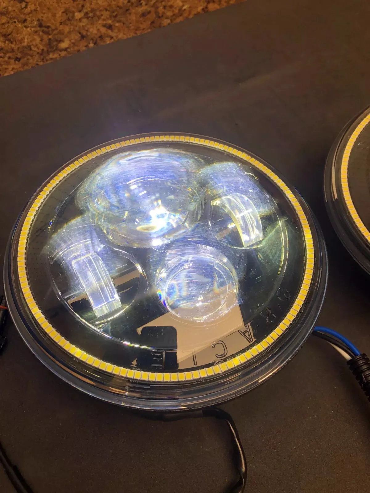 USED ORACLE 7" HIGH POWERED BLACK LED HEADLIGHTS WITH WHITE HALOS 5769-001